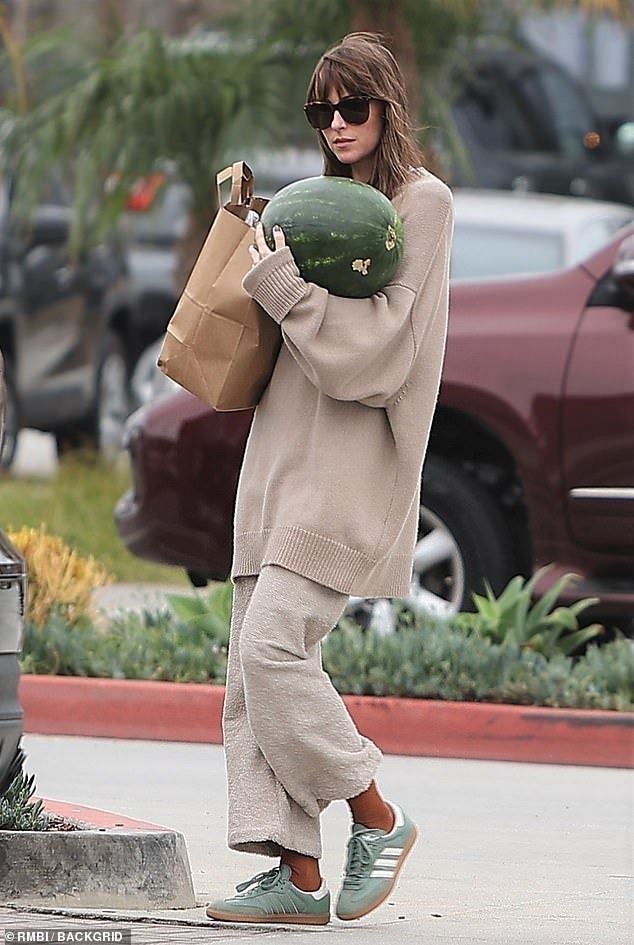 Dakota Johnson spotted in Malibu, grocery shopping with a huge watermelon, rocking a cozy brown attire