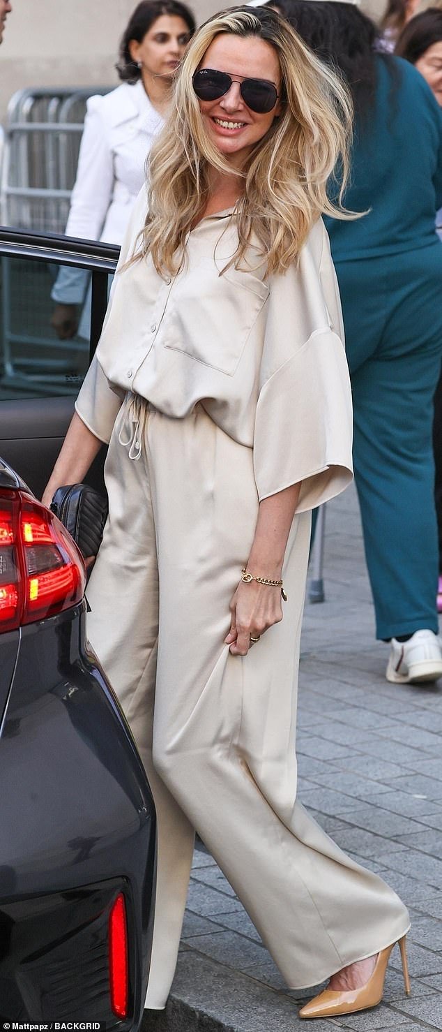 Nadine Coyle chooses elegant daytime attire with a champagne silk co-ord and a £1,200 YSL bag for her visit to BBC studios.