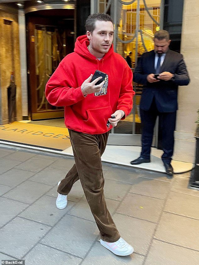 Brooklyn Beckham and his wife Nicola Peltz, accompanied by their beloved pet dogs, arrive at a hotel in London