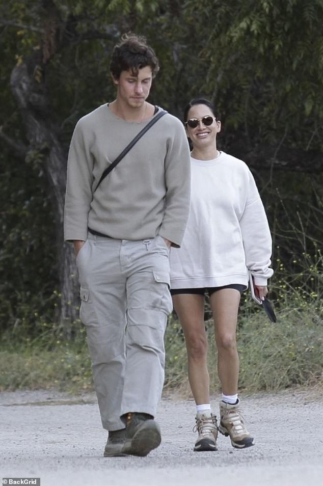 Shawn Mendes casually smokes a cigarette before heading out for a hike in Los Angeles with his trusted chiropractor, Jocelyne Miranda