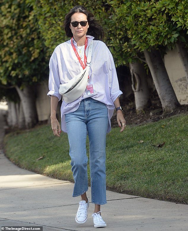 Emma Heming, wife of Bruce Willis, sports a casual look in cropped denim while running errands in Los Angeles.