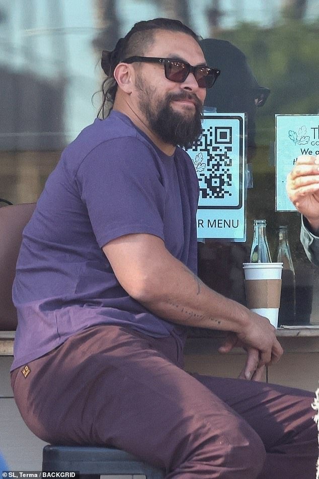 Jason Momoa takes a lunch break to catch up with a friend after hosting Saturday Night Live amidst his hectic work schedule