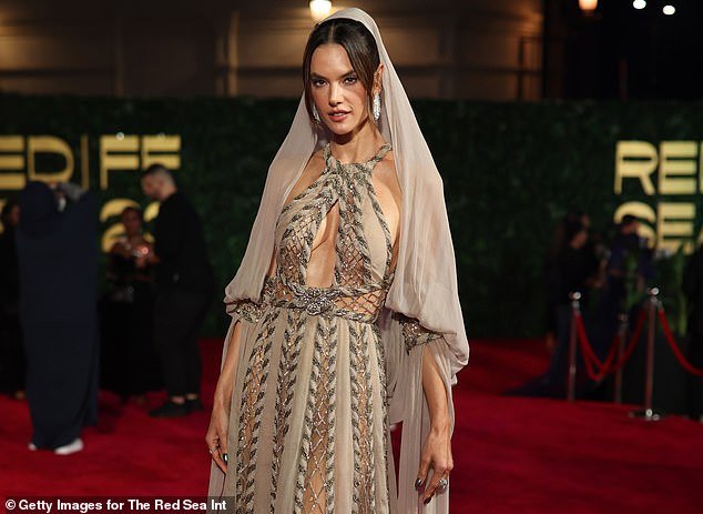 Alessandra Ambrosio looks breathtaking in a sheer headscarf and halter