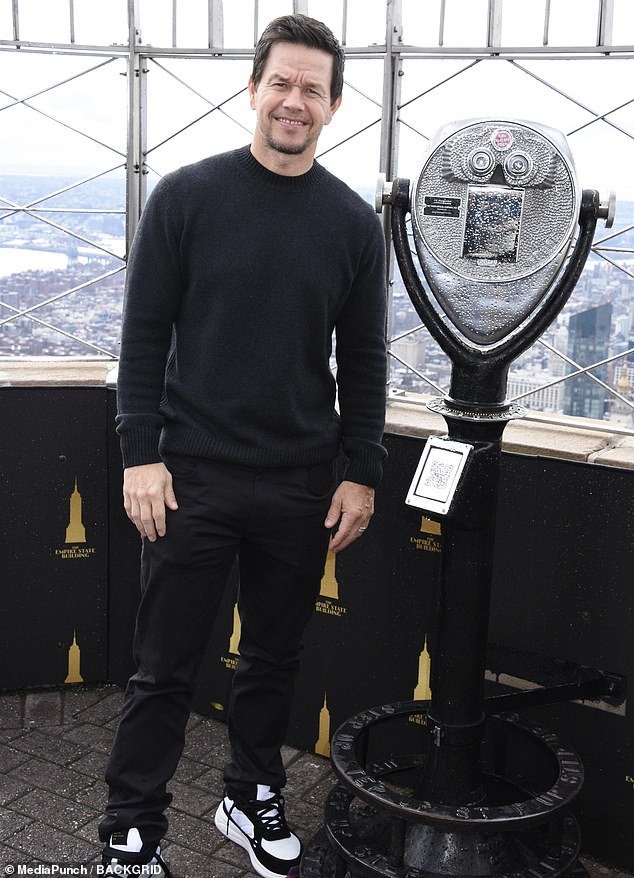 Mark Wahlberg and The Family Plan Cast Visit Empire State Building in NYC in Stylish All-Black Ensembles