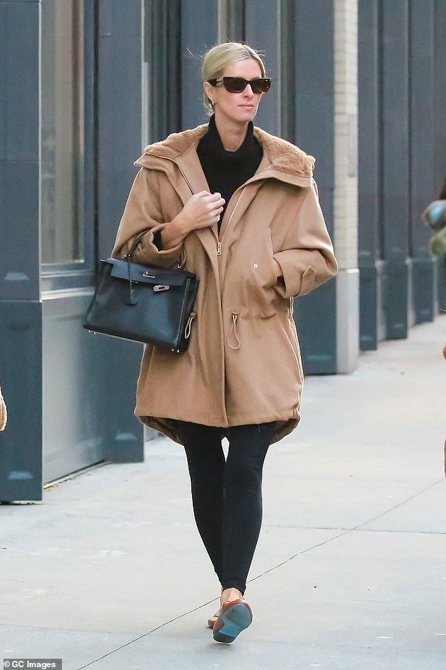 Nicky Hilton rocks a casual chic look in a stylish tan coat and leggings while out in New York City with her lookalike daughters Lily and Teddy