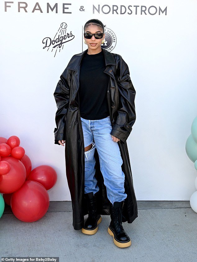 Lori Harvey in a Stylish Leather Trench Coat at Baby2Baby Holiday Event ...