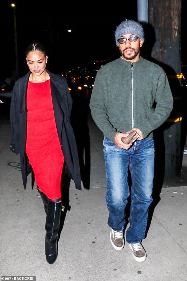 Shanina Shaik looks chic in a red ribbed dress and Givenchy boots during a special outing with boyfriend Matthew Adesuyan