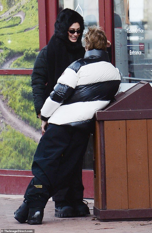 Hailey Bieber admiringly looks at Justin Bieber during their indulgent getaway at a high-end ski resort in Aspen