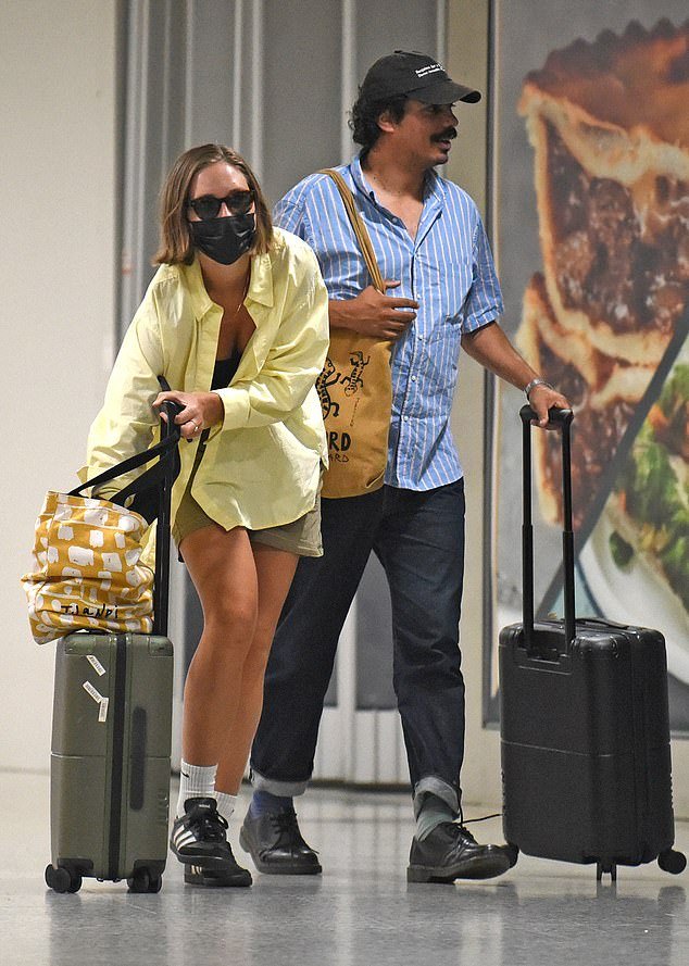 Tony Armstrong and girlfriend Rona Glynn-McDonald reunite in Melbourne after Christmas, leaving people curious about her continued mask usage.