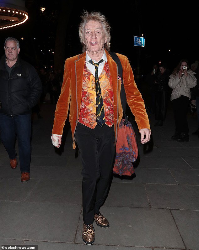 Rod Stewart remains stylish despite nursing an injured hand following a night out at The Kit Kat Club