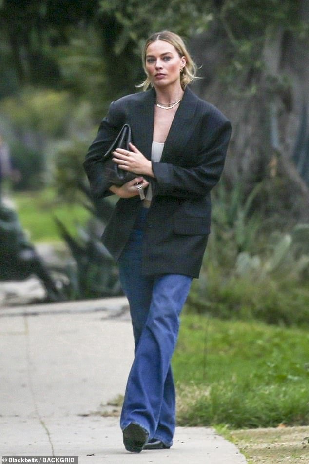 Margot Robbie Embraces Casual Chic in LA with Baggy Blue Jeans and Pinstripe Blazer