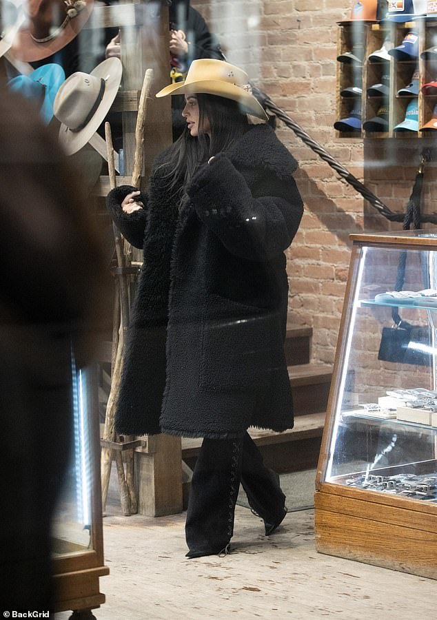 Kim Kardashian dismisses criticism of her viral tanning bed video as she shops for hats in Aspen with sister Khloe, a skin cancer survivor