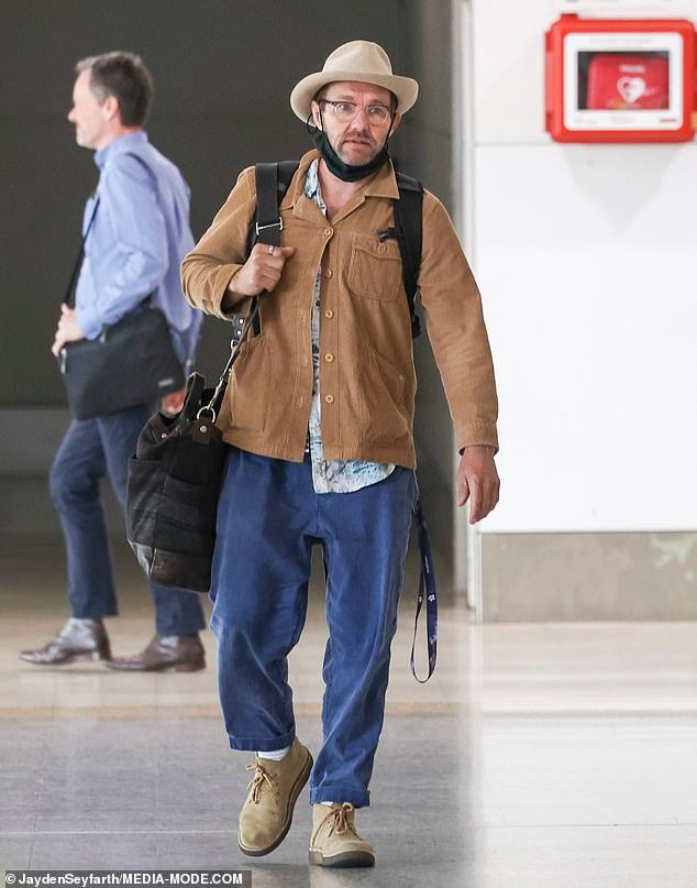 Actor Joel Edgerton from Australia takes time to sign autographs for fans upon arrival at Melbourne Airport