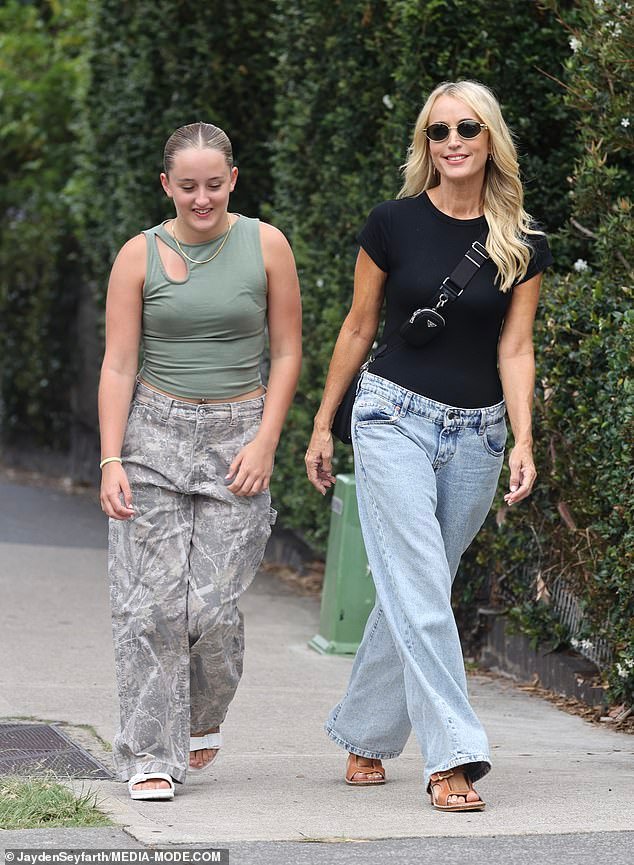 Jackie O Henderson celebrates 49th birthday at Sydney’s Bondi with daughter Kitty, rocking fashionable jeans