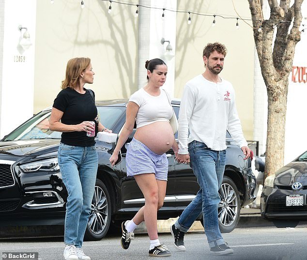 Natalie Joy, Nick Viall’s fiancee, shows off her baby bump in a crop top during a lunch outing in LA