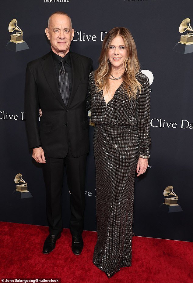 Tom Hanks, Rita Wilson, and son Chet make a stylish trio at Clive Davis’ Pre-GRAMMY Gala, with Hanks looking dapper in a black tuxedo