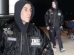 Travis Barker leaves Sydney solo to reunite with blink-182 bandmates in Perth, leaving wife Kourtney Kardashian and baby Rocky behind