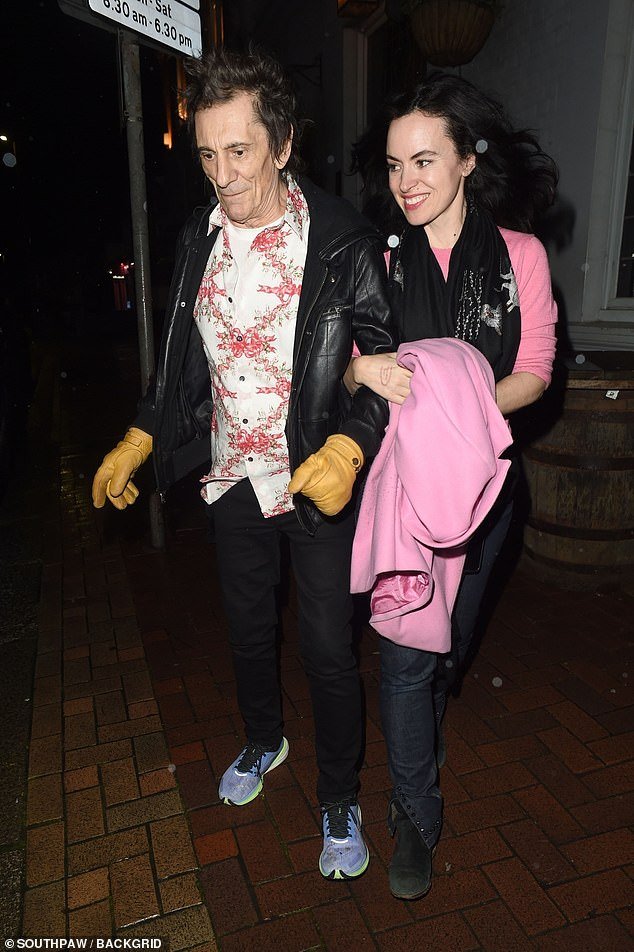 Ronnie Wood, 76, sports mustard leather gloves during date night with stylish wife Sally, 45, in London