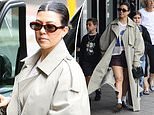 Kourtney Kardashian takes her children to a fancy Sydney restaurant, sporting shorts and a trench coat