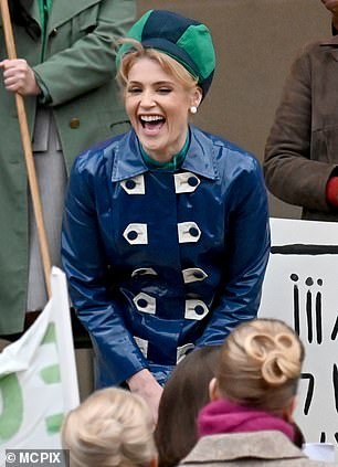 Gemma Arterton enjoys her time on set as she films 1960s raincoat scenes for Funny Woman series two in Manchester