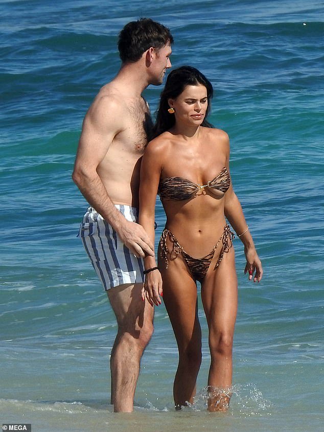 Brooks Nader flaunts her stunning physique in a small patterned bikini during a beach day with husband Billy Haire in Mexico