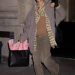 Iris Law bundles up in an oversized jacket and baggy jeans for New York Fashion Week outing