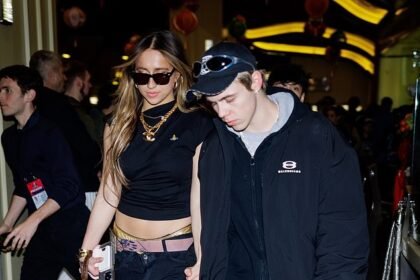 The Kid Laroi and Tate McCrae seen leaving Michael Rubin’s Fanatics party holding hands, despite her claims of being single, sparking dating rumors.