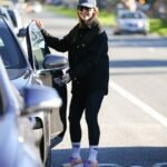 Jennifer Garner stays stylish and active in leggings and a fashionable coat while taking a walk with a friend in LA.