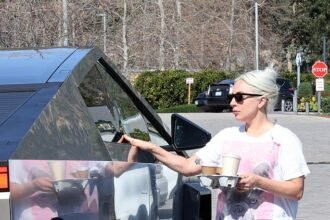 Lady Gaga opts for a casual look in cuffed jeans and a white T-shirt while running errands in her 0K Tesla Cybertruck