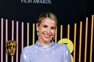 Vogue Williams Stuns in Shimmering Purple Feather Gown at the 2024 BAFTAs, Joins Glamorous Clara Amfo on the Red Carpet