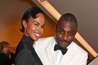 Idris Elba adores his wife Sabrina at the 2024 BAFTAs, snapping a loved-up photo after her stunning red carpet appearance in a plunging dress