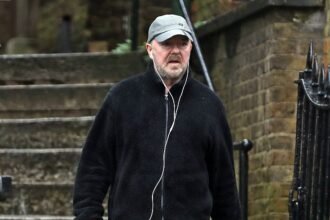 Ricky Gervais, 62, appears sad in his first public appearance since The Office star Ewen MacIntosh’s shocking death