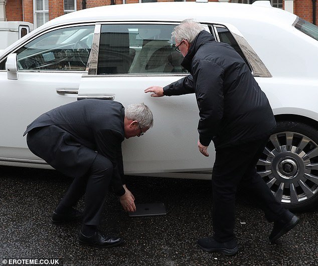 Rock Veteran Stewart Drops His Pricey Laptop As He Exits Chauffeur-Driven Car With Wife Penny Lancaster Upon Arriving At London Studio