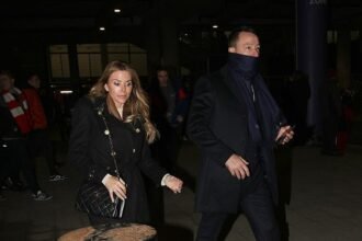 John Terry and his elegant wife Toni appeared somber as they depart Wembley following Chelsea’s defeat in the Carabao Cup final.