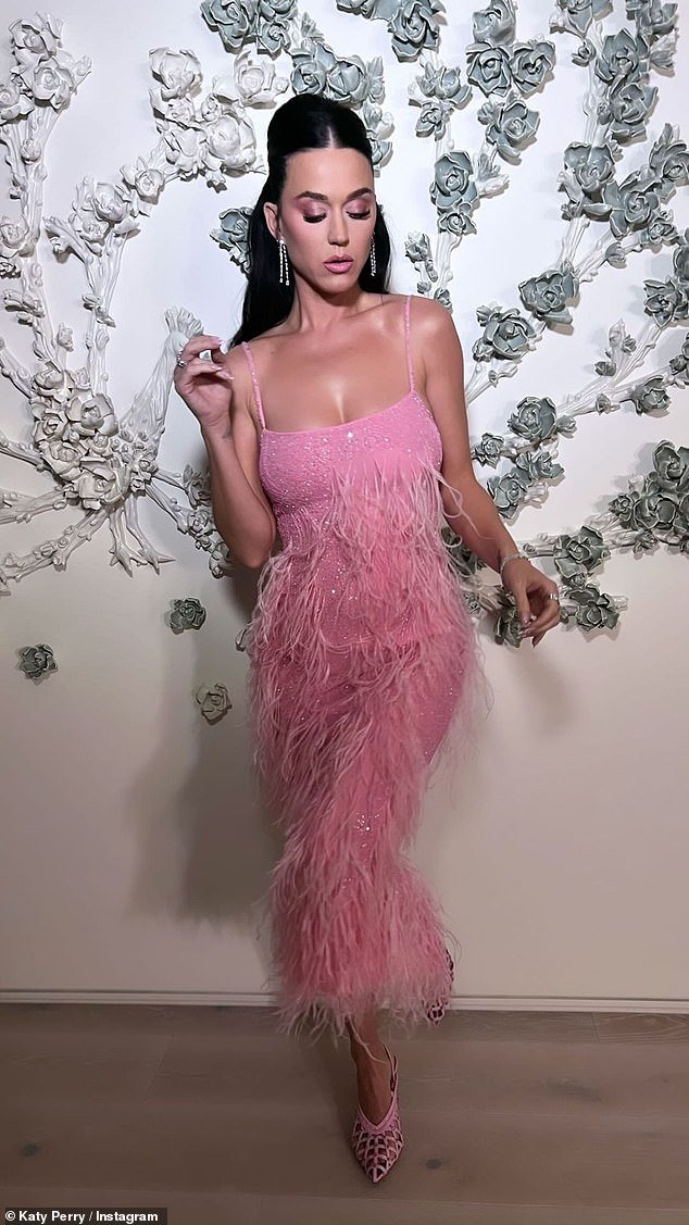 Katy Perry stuns in a pink sequin dress adorned with feathers in a new ...