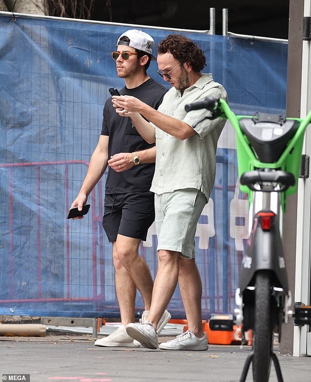 The Jonas Brothers, Nick and Kevin, enjoy a friendly game of tennis in Sydney before starting their Australian tour.