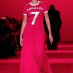 Georgina Rodriguez honors Cristiano Ronaldo’s iconic number seven jersey as she struts down the runway at the Vetements Paris Fashion Week show.