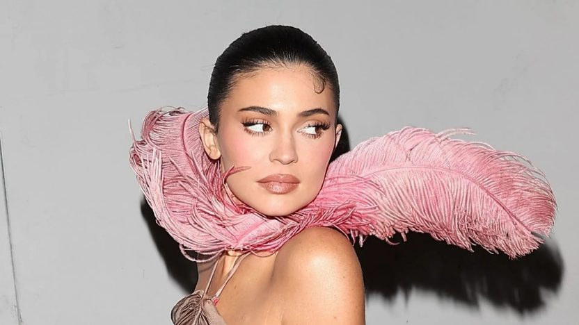Kylie Jenner Stuns in Backless Pink Feather Dress at Holiday Bash